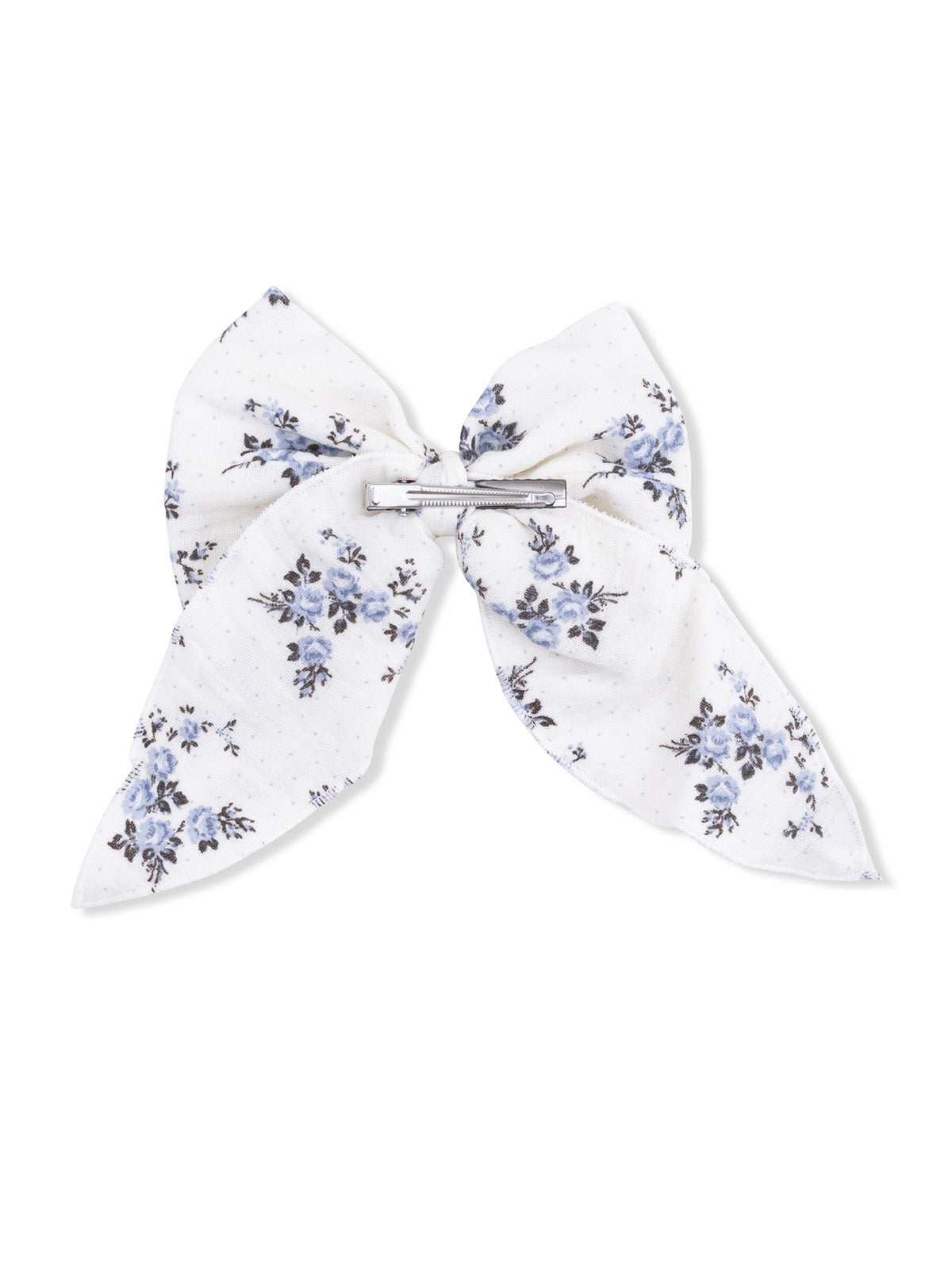 White hair bow with blue floral pattern and a silver clip at the center.