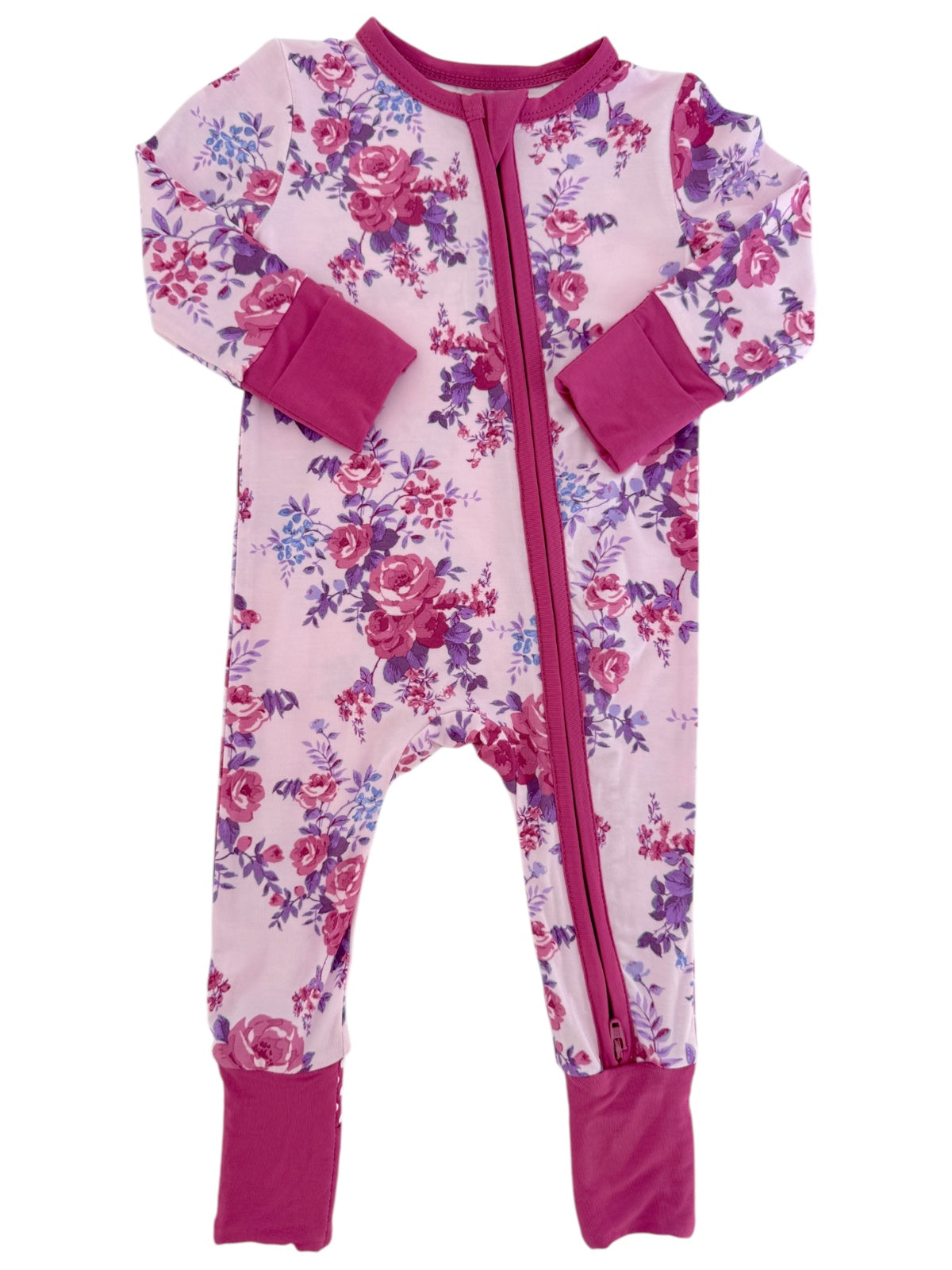 Pink floral onesie with long sleeves and zipper, featuring purple and pink accents at cuffs and collar.