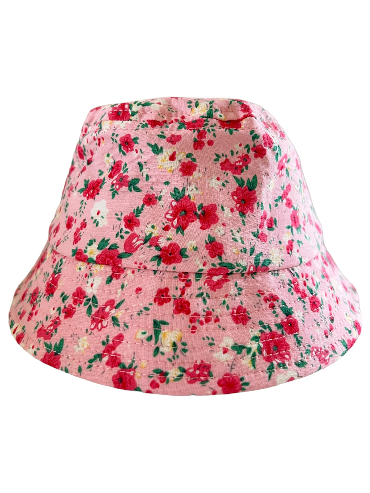 Pink floral bucket hat with a vibrant pattern of red and yellow flowers on a soft background.