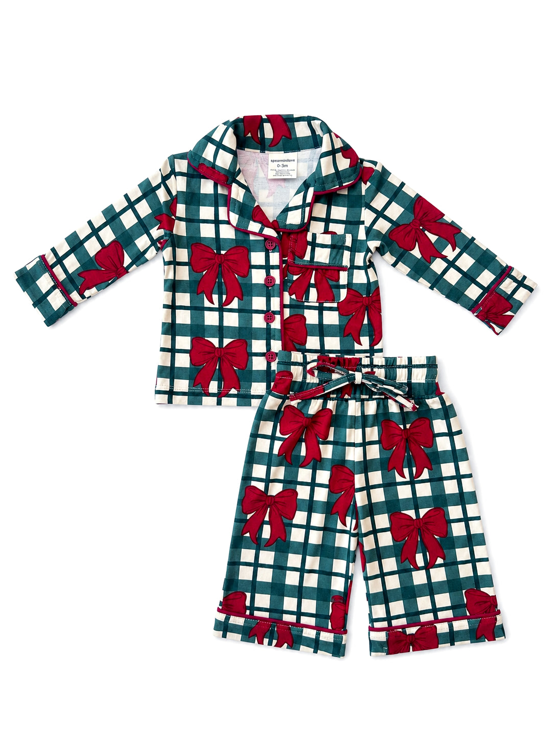 Green plaid pajamas with red bows, featuring a button-up top and matching pants. Suitable for infants and toddlers.