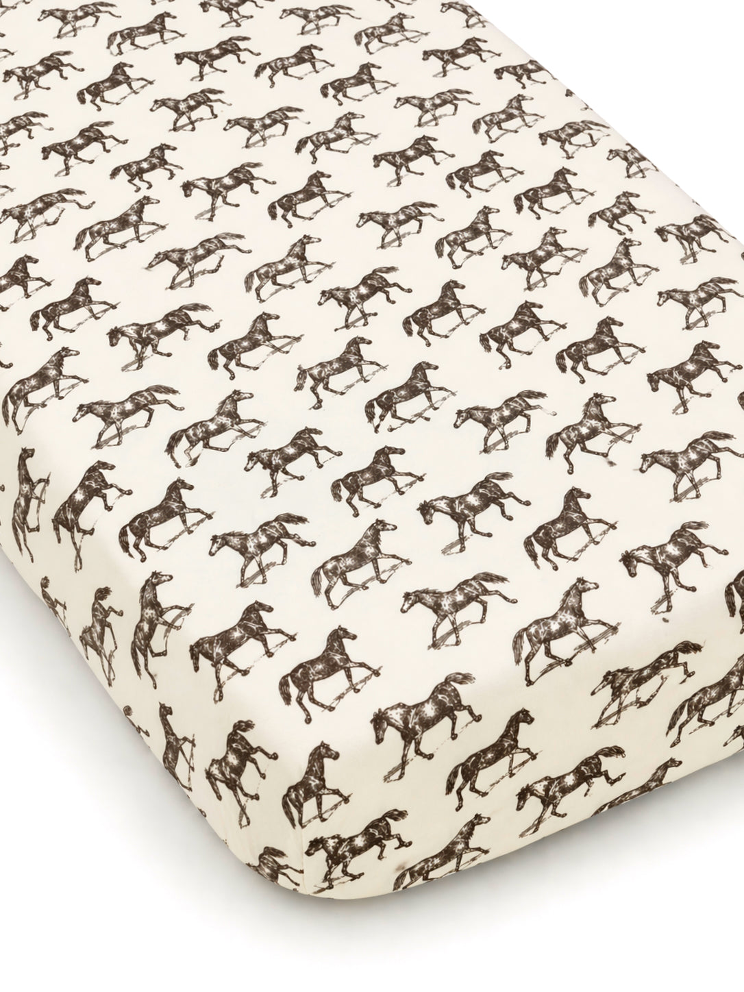 Horse-patterned crib sheet featuring repeated brown silhouettes on a cream background. Ideal for equestrian-themed nurseries.
