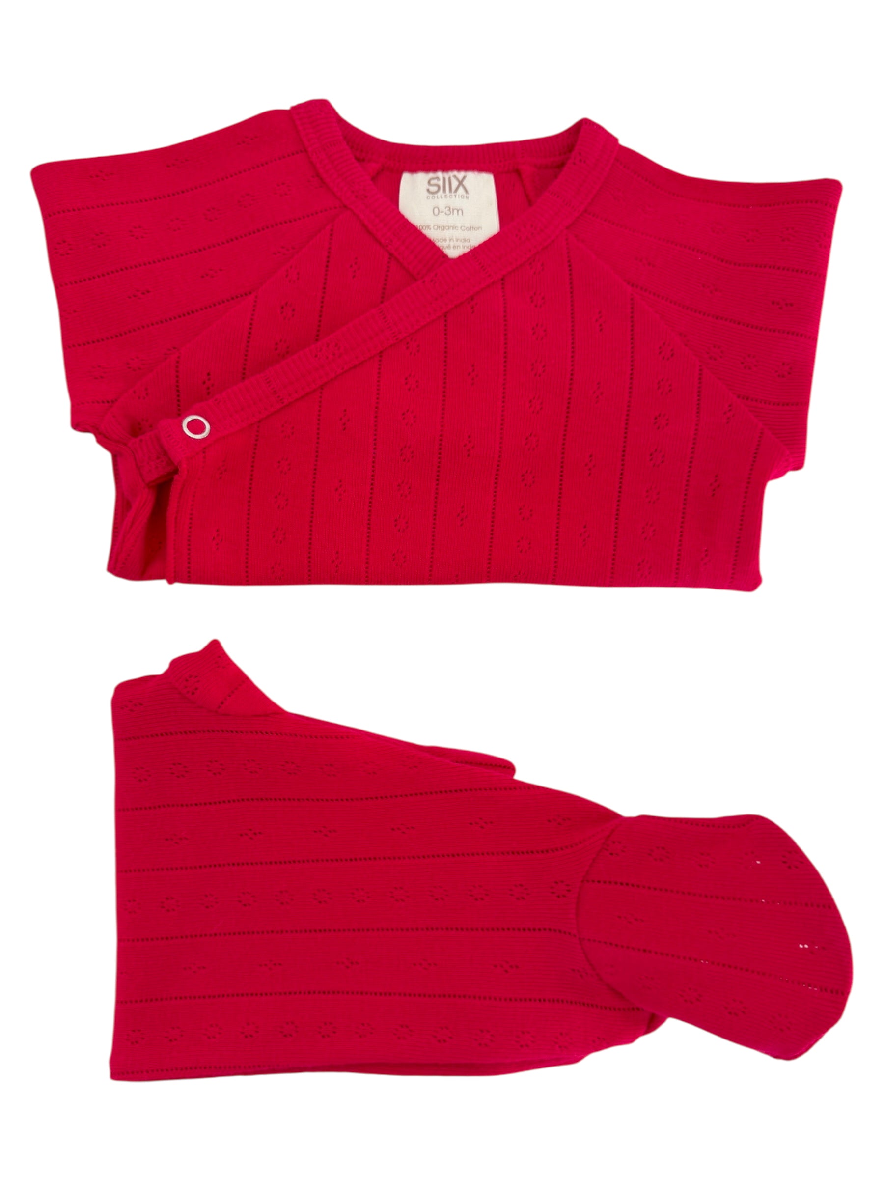 Bright red, organic cotton infant outfit with a cross-body design and flower patterns, suitable for ages 0-3 months.