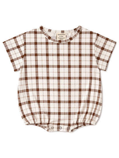 Brown and white plaid baby romper with short sleeves and snap closures at the bottom.
