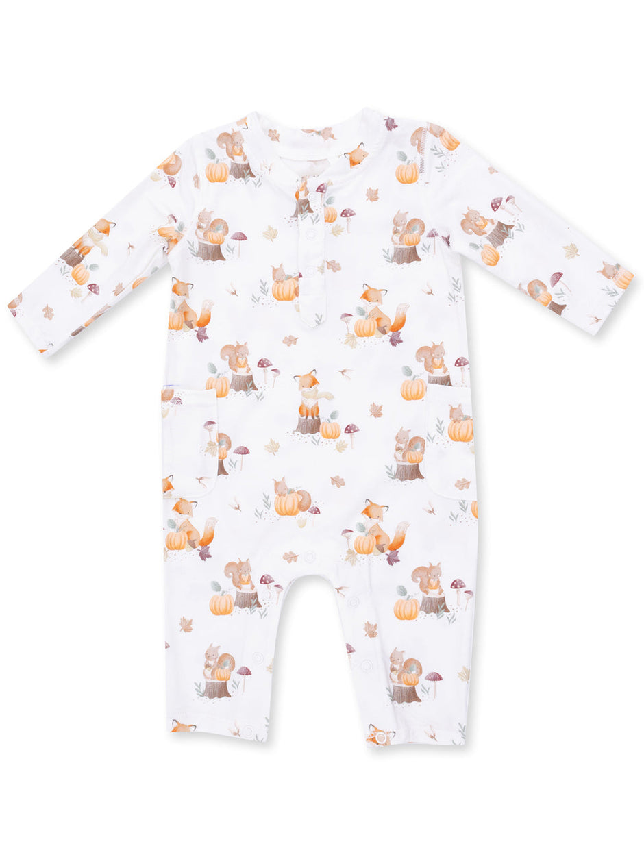 Long-sleeve baby onesie featuring a whimsical autumn print of foxes, squirrels, pumpkins, and mushrooms.
