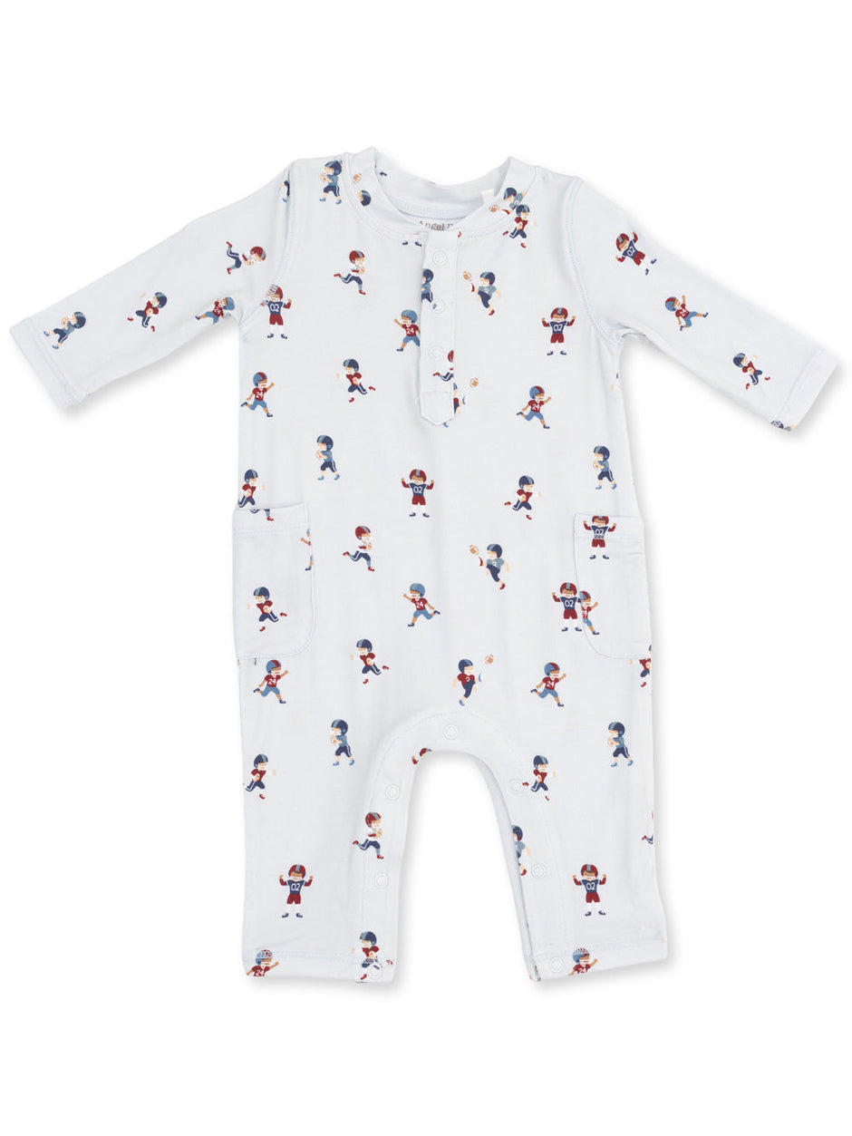 White infant romper with colorful sports-themed patterns and pockets. Ideal for playful and active babies.