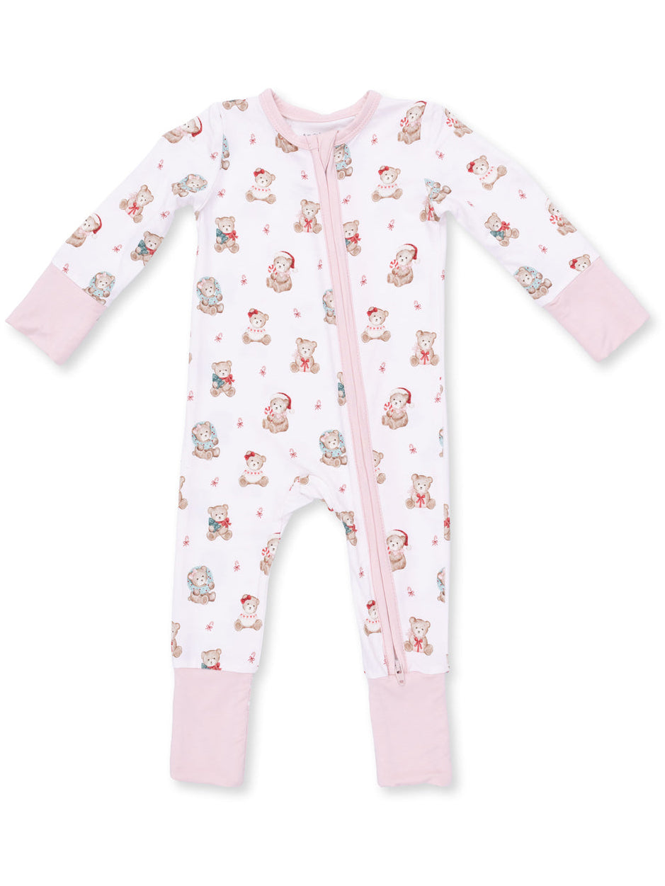 Baby onesie with pink sleeves, featuring a cute teddy bear print on a white background. Zipper closure in front.