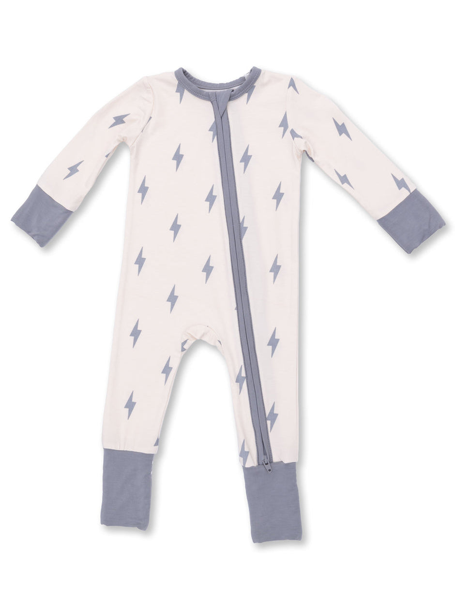 Light-colored infant onesie with lightning bolt patterns and contrasting gray sleeves, featuring a front zipper.
