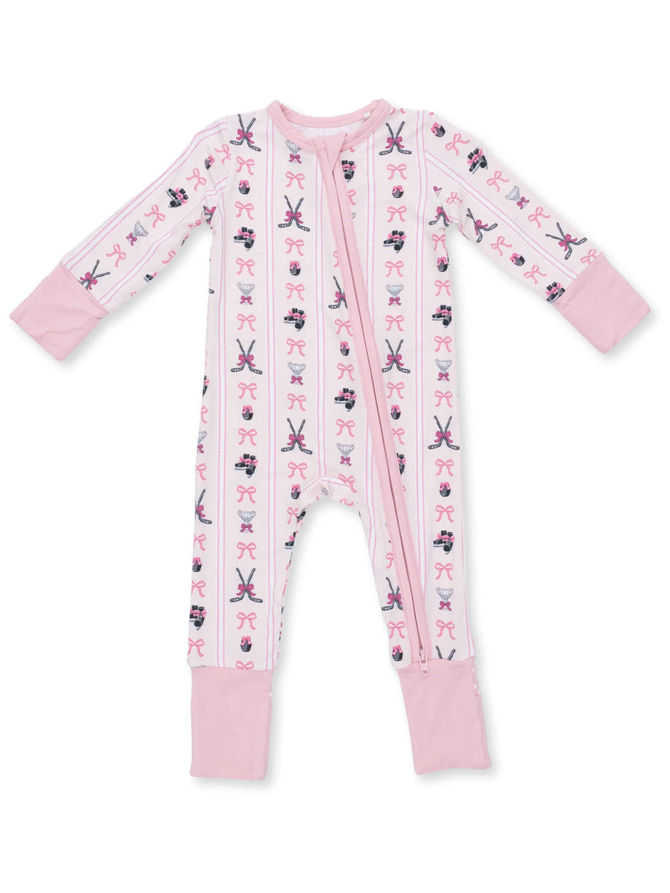Pink baby onesie featuring patterns of bows, scissors, and ballet shoes. Full zip front and long sleeves.