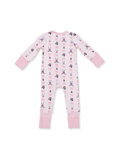 Pink baby onesie featuring whimsical patterns of bows, cupcakes, and sewing tools. Back view.