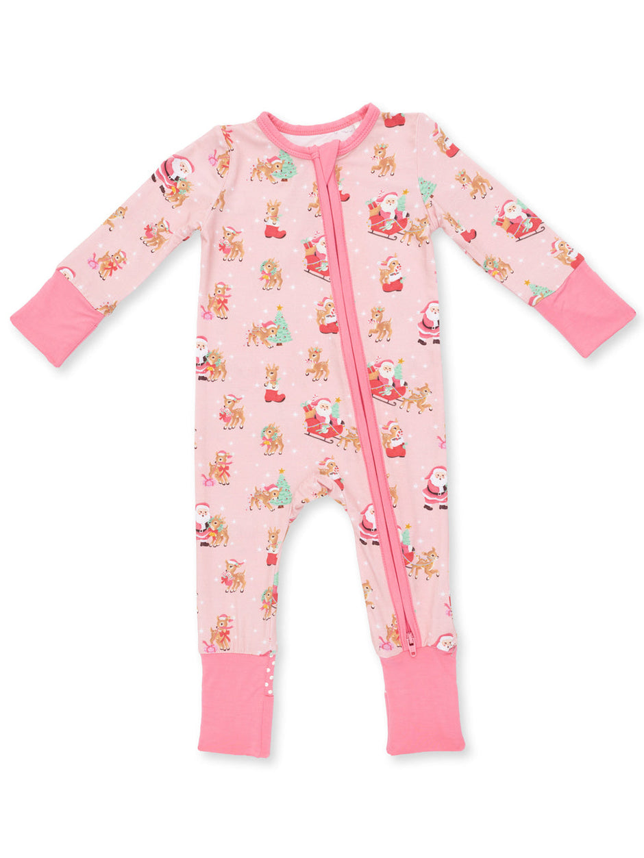 Pink holiday-themed baby onesie with Santa and reindeer patterns, featuring a front zipper and long sleeves.