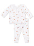 White baby pajamas with basketball print, featuring a long-sleeve top and matching pants.