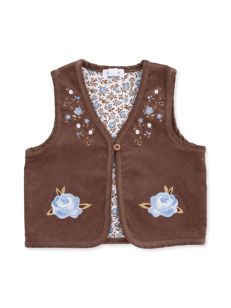 Brown vest adorned with blue floral embroidery and a floral patterned interior.