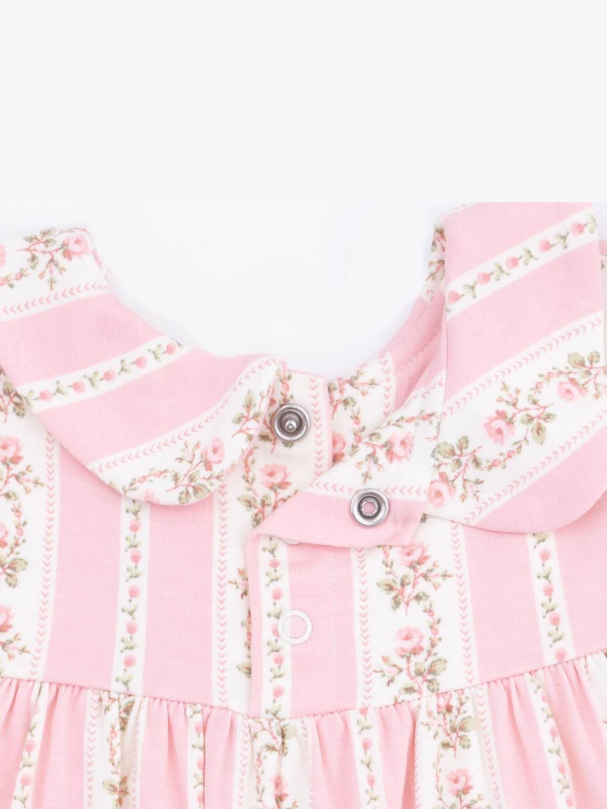 Pink floral dress featuring a collar, snap buttons, and vertical striped patterns. Ideal for young children.