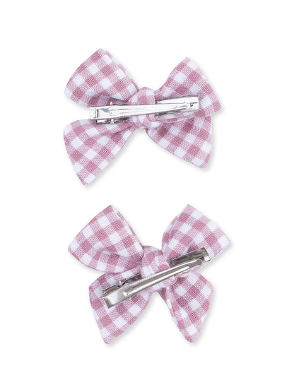 Pink and white gingham bow hair clips with metal clips on the back. Two clips displayed side by side.