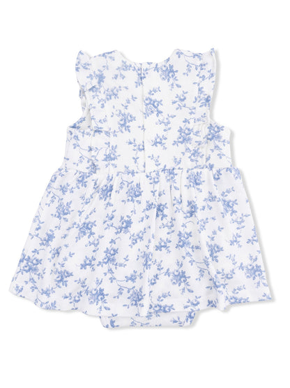 White floral dress with blue patterns and ruffled sleeves, viewed from the back. Suitable for infants.
