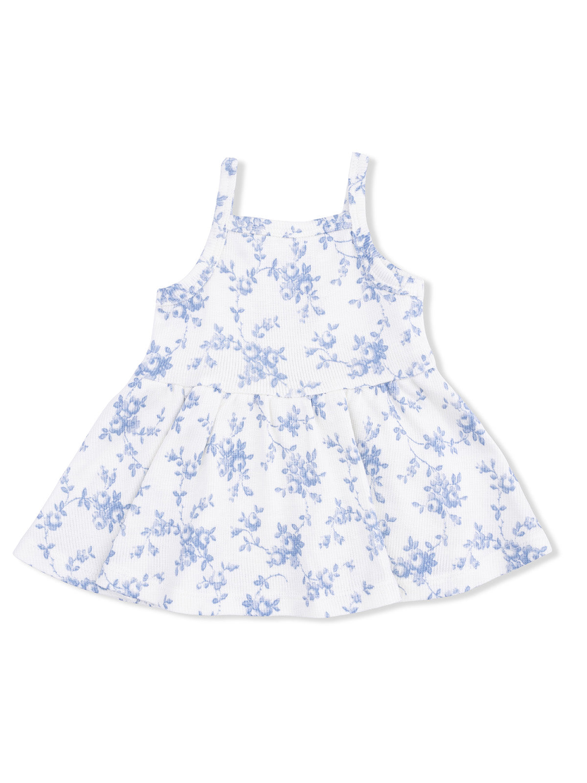 White dress with blue floral pattern and spaghetti straps, featuring a flared skirt. Perfect for summer wear.