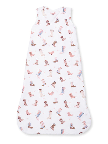 White sleep sack with colorful cowboy boot patterns. Ideal for infants, offering comfort and style.