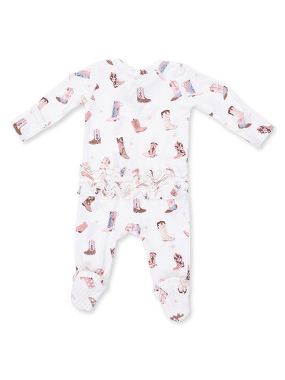 White baby onesie with a cowboy boot pattern and ruffled waist, featuring long sleeves and footed design.