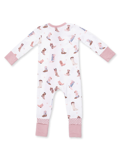 White pajama suit with colorful boot prints and pink cuffs, perfect for kids' cozy sleepwear.