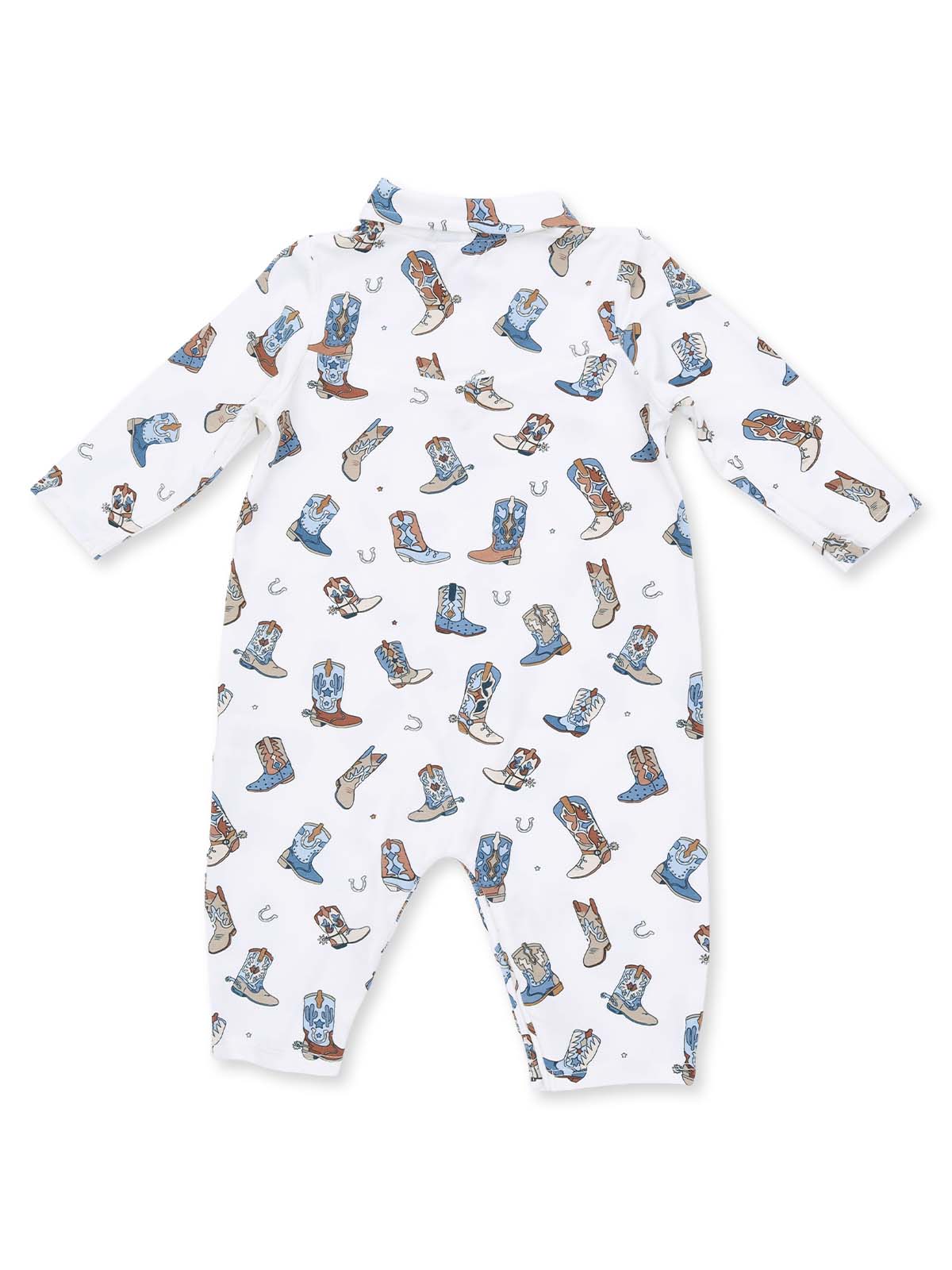 White baby onesie adorned with colorful cowboy boots and horse shoes pattern.