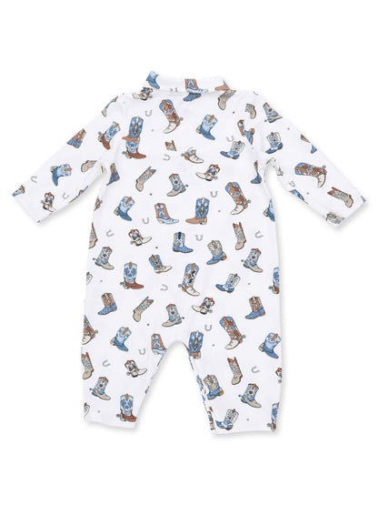 White baby onesie adorned with colorful cowboy boots and horse shoes pattern.