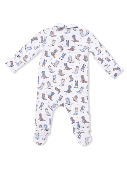 White onesie covered in a playful cowboy boot pattern, featuring long sleeves and footed legs.