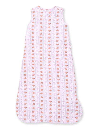 Light pink sleeping bag with cute patterns of orange cups and purple swirls, designed for infants.