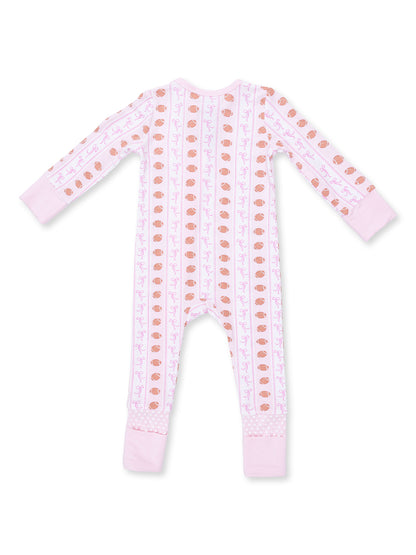 Pink infant onesie with playful patterns of bows and yarn balls, featuring long sleeves and footed design.