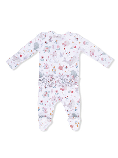 White baby onesie with colorful sea creature and flower patterns, featuring a ruffled back and footed design.