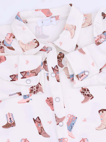 White shirt collar featuring a playful pattern of colorful cowboy boots and floral designs.