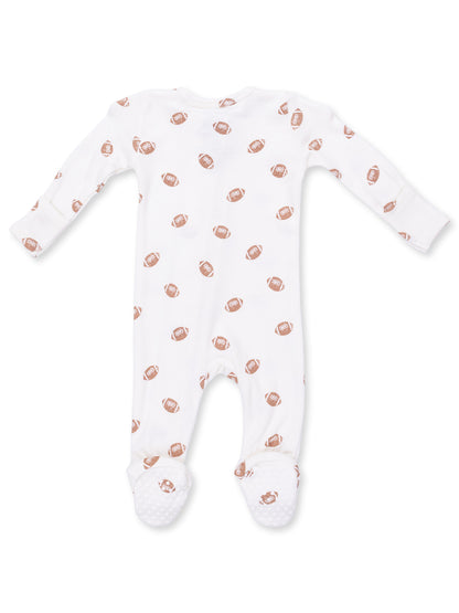White baby onesie with repeating brown football pattern and non-slip feet for added safety. Perfect for infants.