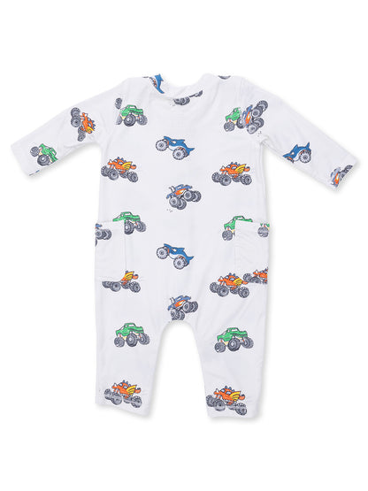 White baby onesie featuring colorful monster truck prints throughout. Ideal for playful outfits.