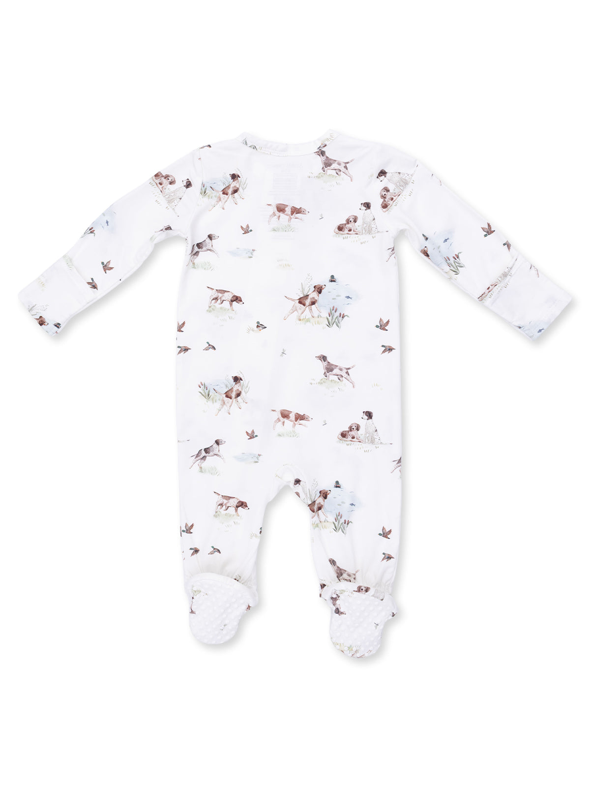 White baby onesie with playful dog and nature print, featuring long sleeves and footed design.