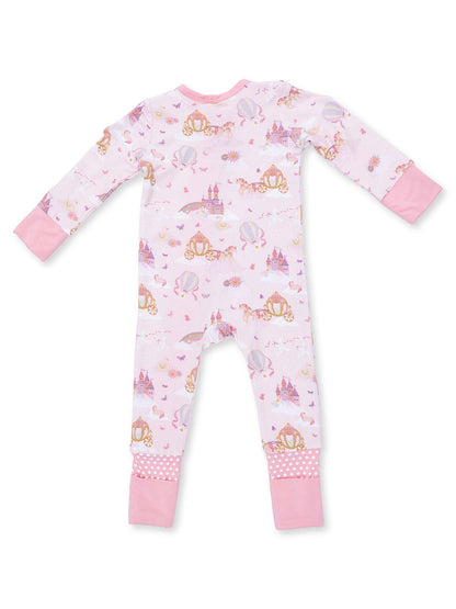 Pink children’s pajama featuring whimsical patterns of castles, unicorns, and hot air balloons. 