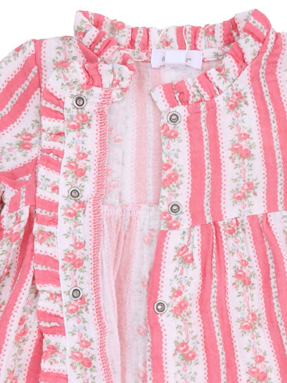 Pink striped dress with floral accents and ruffled neckline, featuring snap closures. Suitable for infants or toddlers.