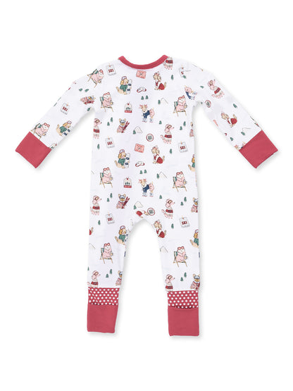 Children's pajamas with playful animal and winter activity prints, featuring long sleeves and polka dot accents.