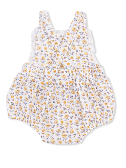 Toddler romper with yellow floral pattern and ruffled straps, featuring elastic waistband for comfort.