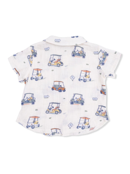 White short-sleeve shirt featuring colorful golf cart patterns against a light background.