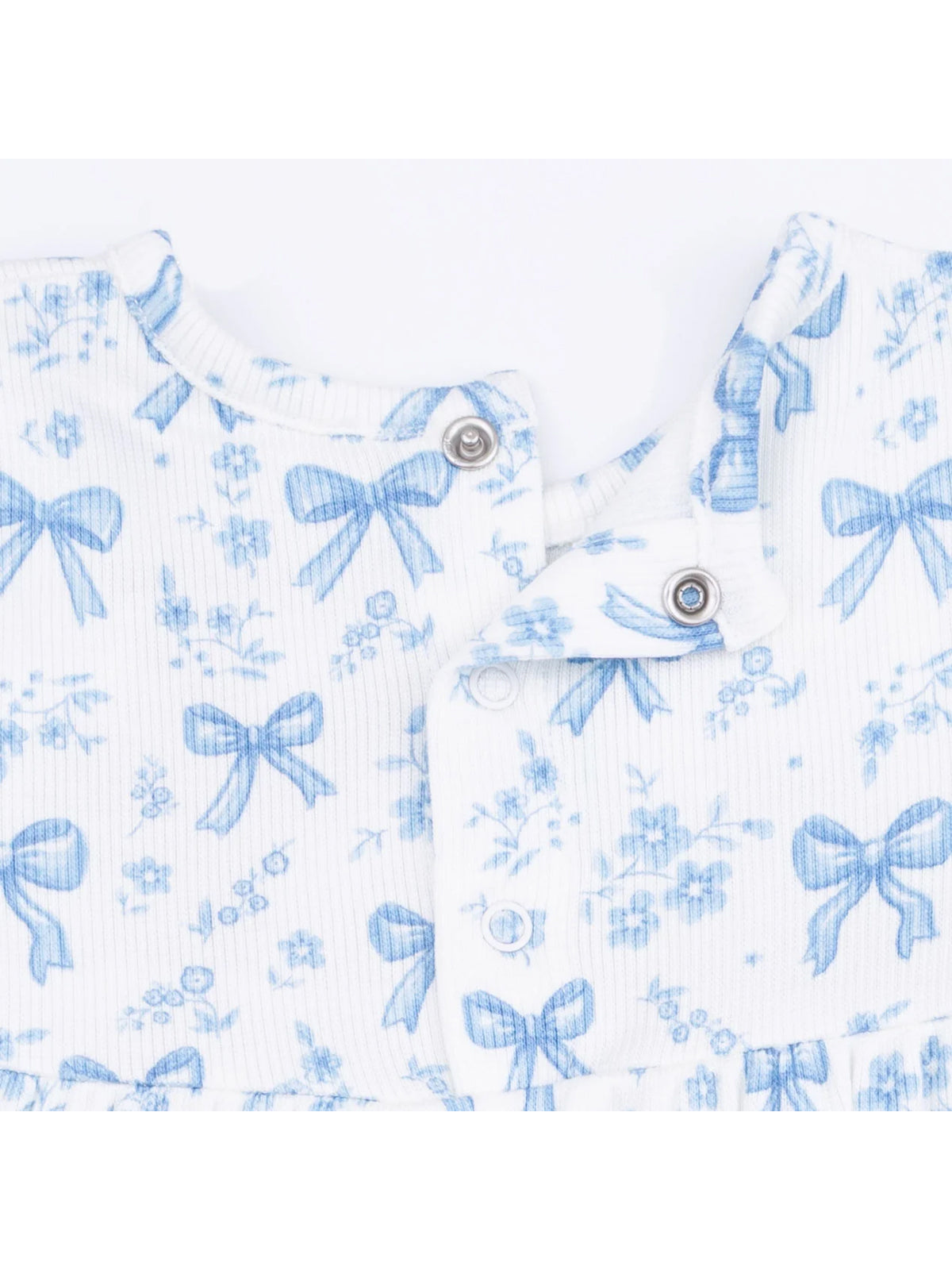 Blue floral pattern fabric with bows, featuring snaps at the neckline. Ideal for children's clothing.