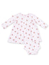 Cute baby dress and shorts set with a pink cupcake pattern on a white background. Perfect for playful occasions.