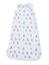 Light blue sleep sack featuring playful puppy illustrations in various poses on a soft fabric background.