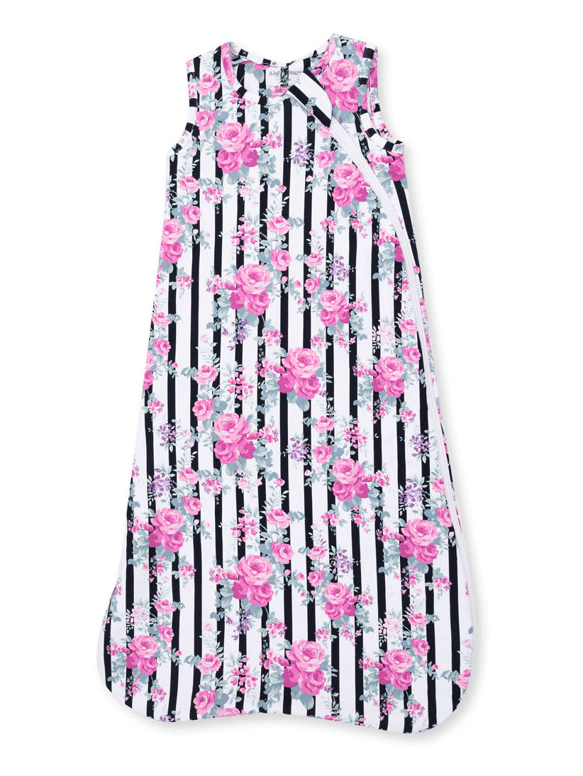 Floral sleeveless dress with pink roses and black-striped background. Ideal for casual summer wear.