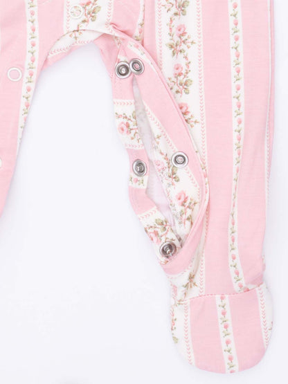 Pink floral-patterned baby onesie with snaps and striped design. Ideal for infants and toddlers.