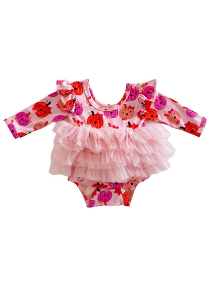 Pink dress with ruffled sleeves, featuring pumpkin patterns and a tulle overlay for a cute, festive look.
