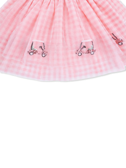 Pink gingham skirt with decorative sequined tractors on the hem. Ideal for children's casual wear.