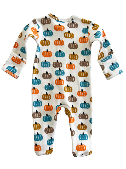 Baby romper with a colorful pumpkin pattern on a white background. Long sleeves and footed design.
