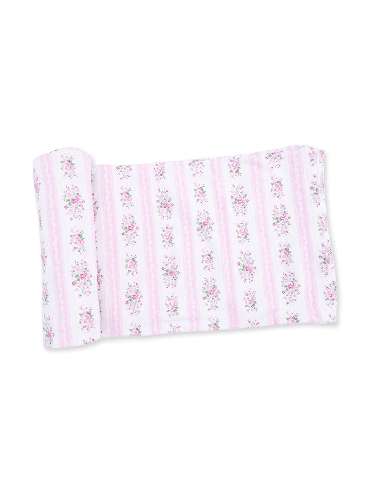 Light pink fabric with floral pattern and white stripes, rolled neatly for display.
