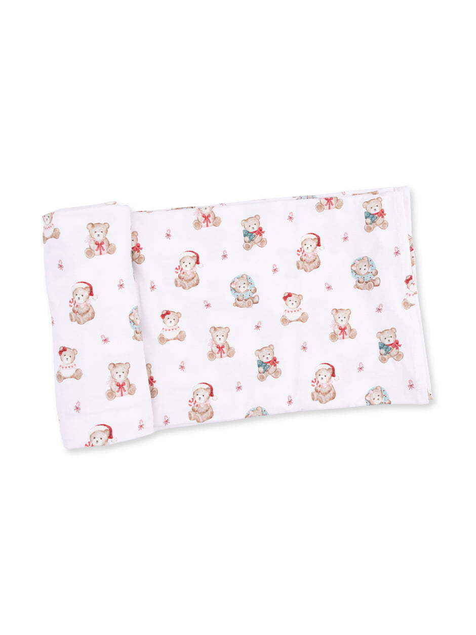 White fabric with a playful bear pattern, featuring teddy bears in Santa hats and colorful scarves.
