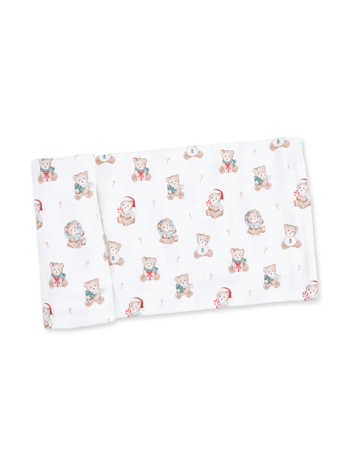 Patterned baby blanket featuring cute teddy bears and candy canes on a white background.