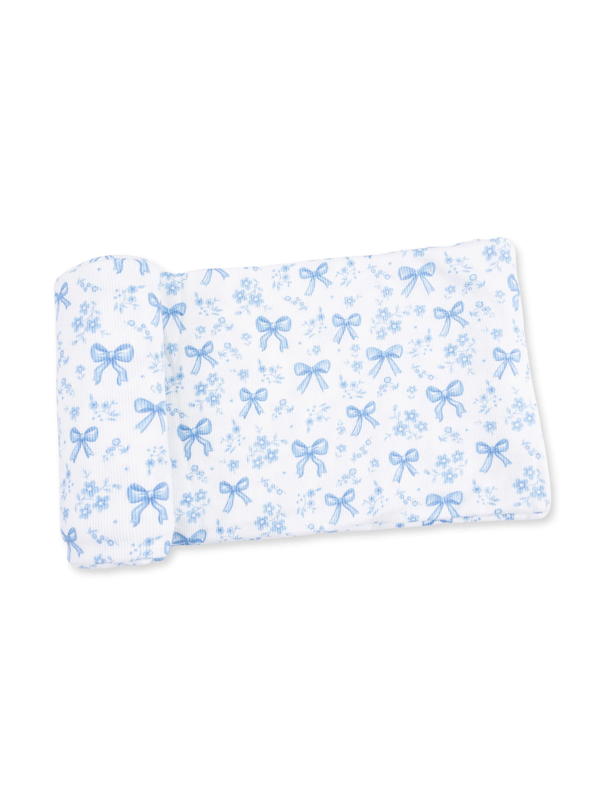 Blue and white patterned fabric featuring bows and flowers laid flat.